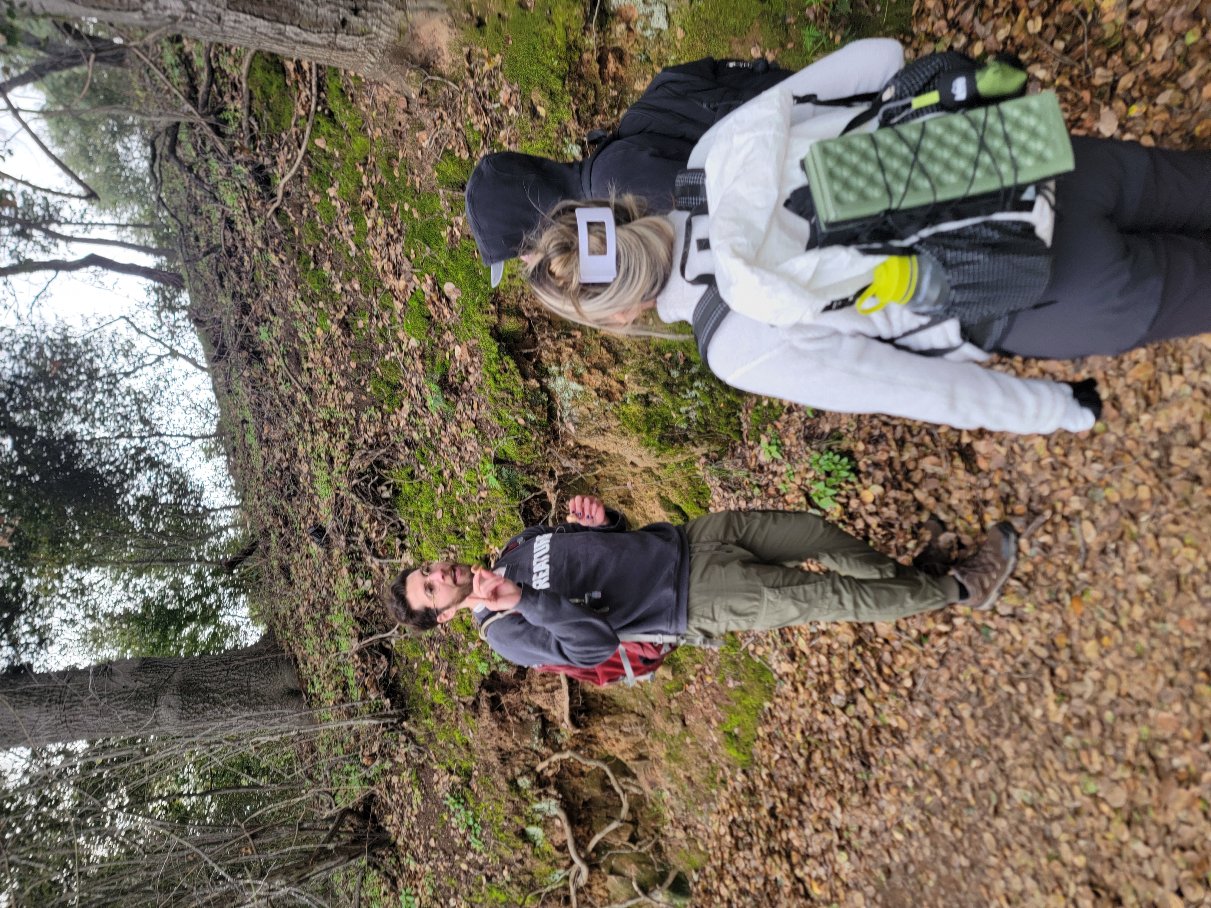 Nick teaching two people about a mushroom